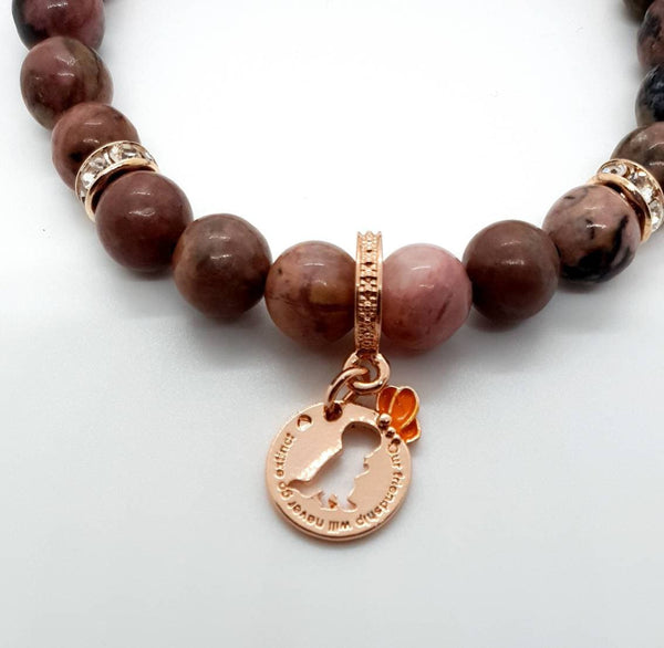 Handmade Rhodonite Crystal Beaded Bracelet With Rose Gold Dinosaur Charm